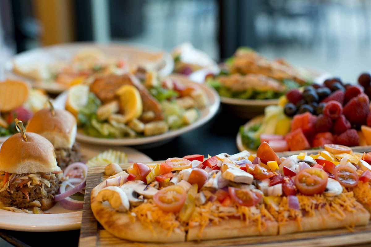 Pizza, pulled pork sandwiches and salad.