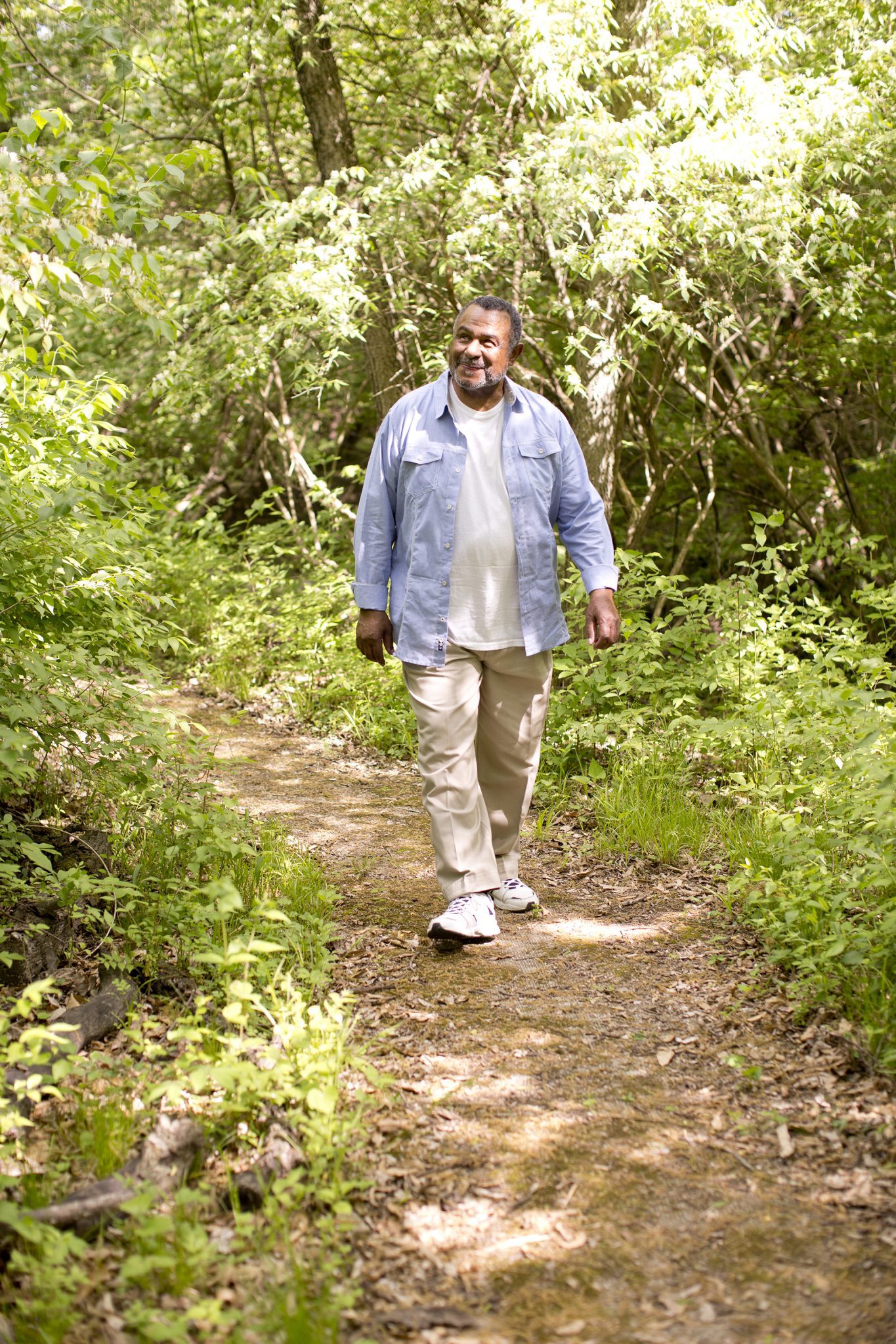 A man walking on the trail at Kingswood Senior Living Located in Kansas City, MO.t