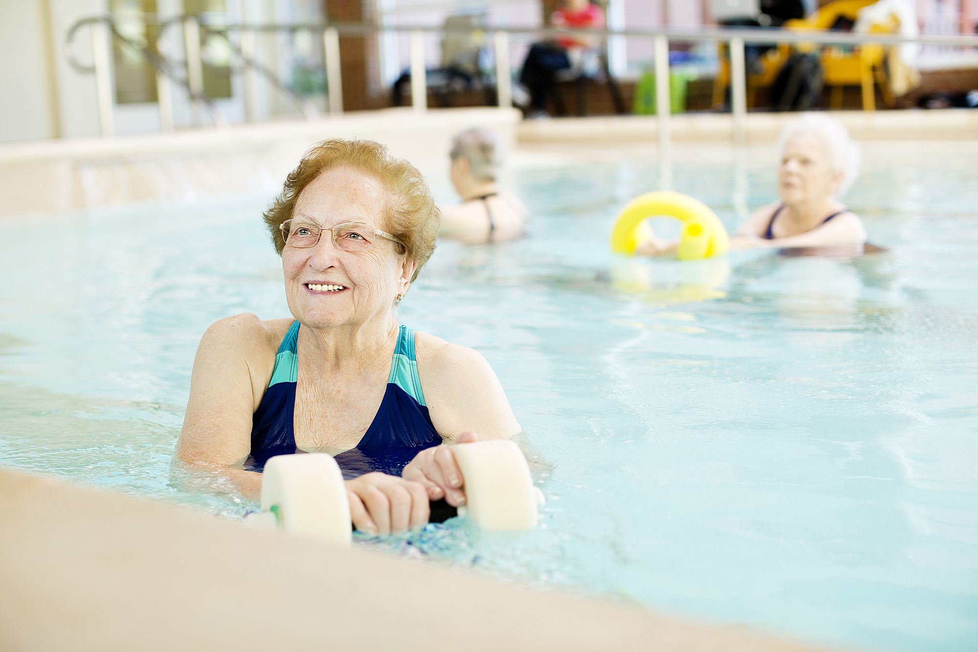 Women enjoying the pool at Kingswood Senior Living Located in Kansas City, MO.