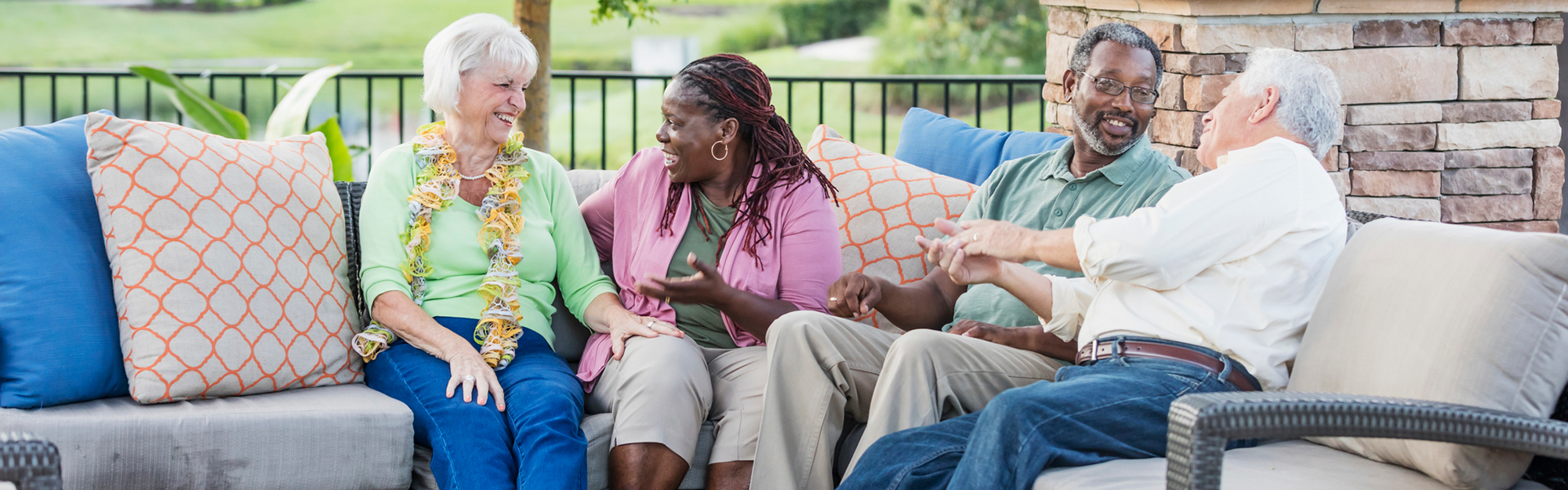 Two couples enjoying the patio at Kingswood Senior Living Located in Kansas City, MO.