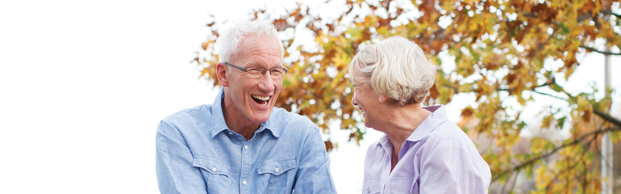 A couple outside enjoying nature at Kingswood Senior Living Located in Kansas City, MO.