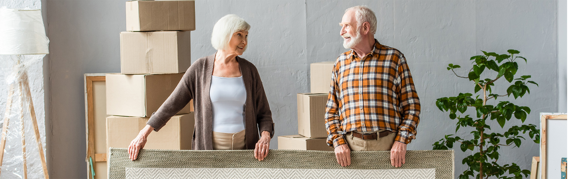 Senior couple with moving boxes