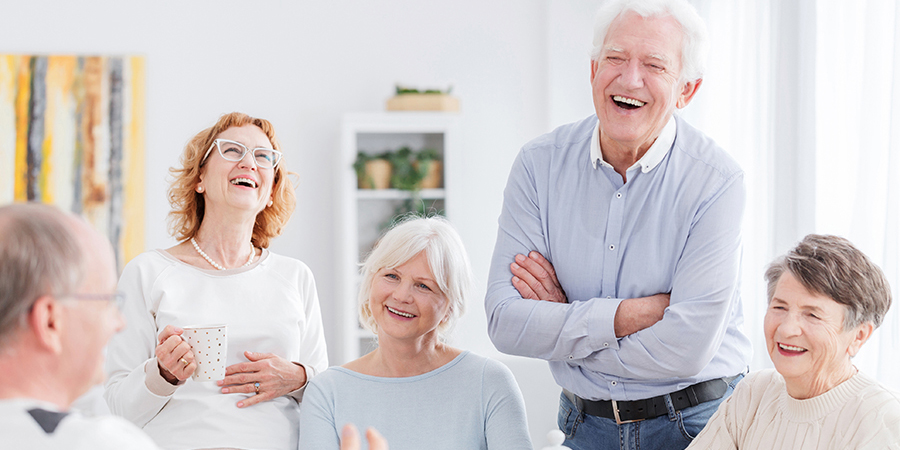 Group of happy older people laughing together on a meeting