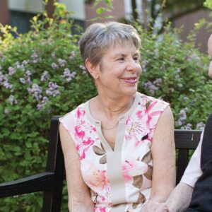 couple talking on a bench