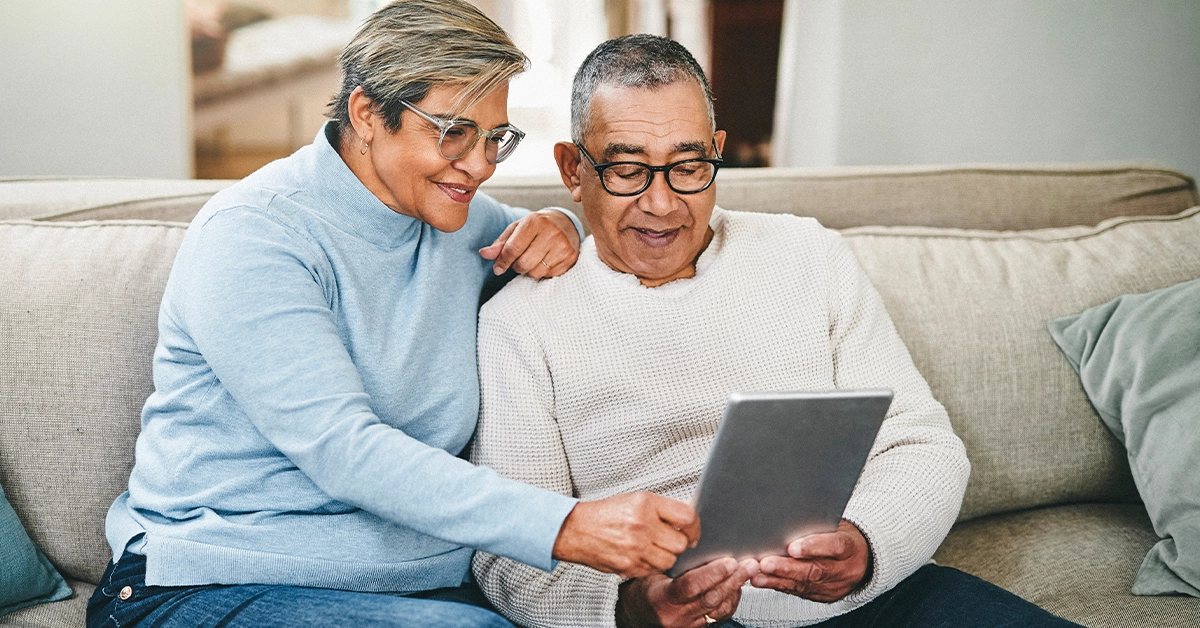 couple looking at tablet