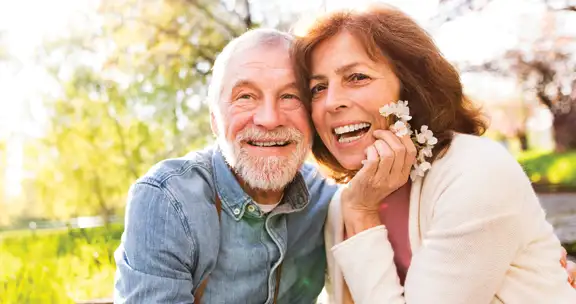 Happy couple smiling outdoors