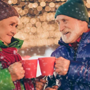 Man and woman with hot drinks